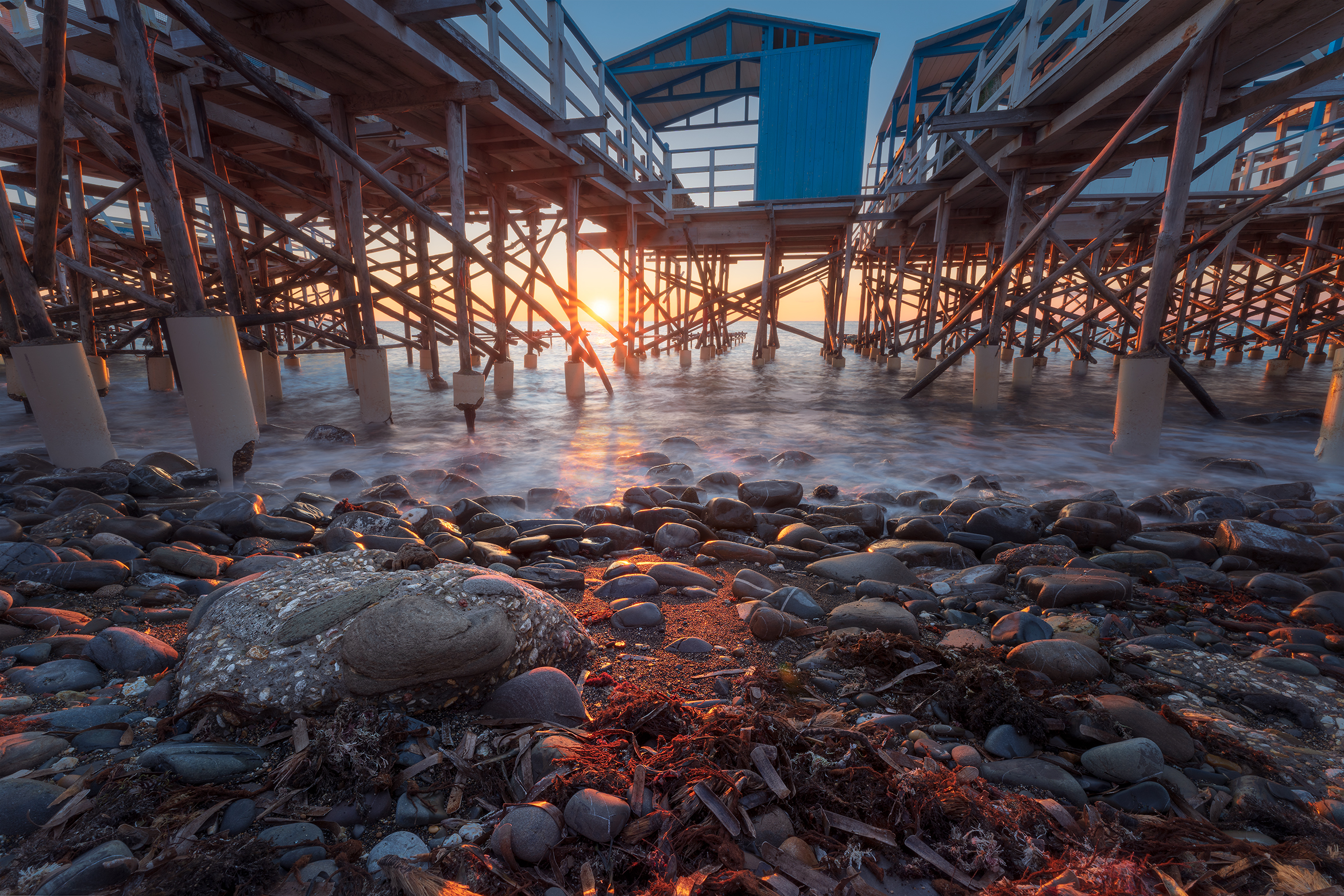 A sunset under the stilt house