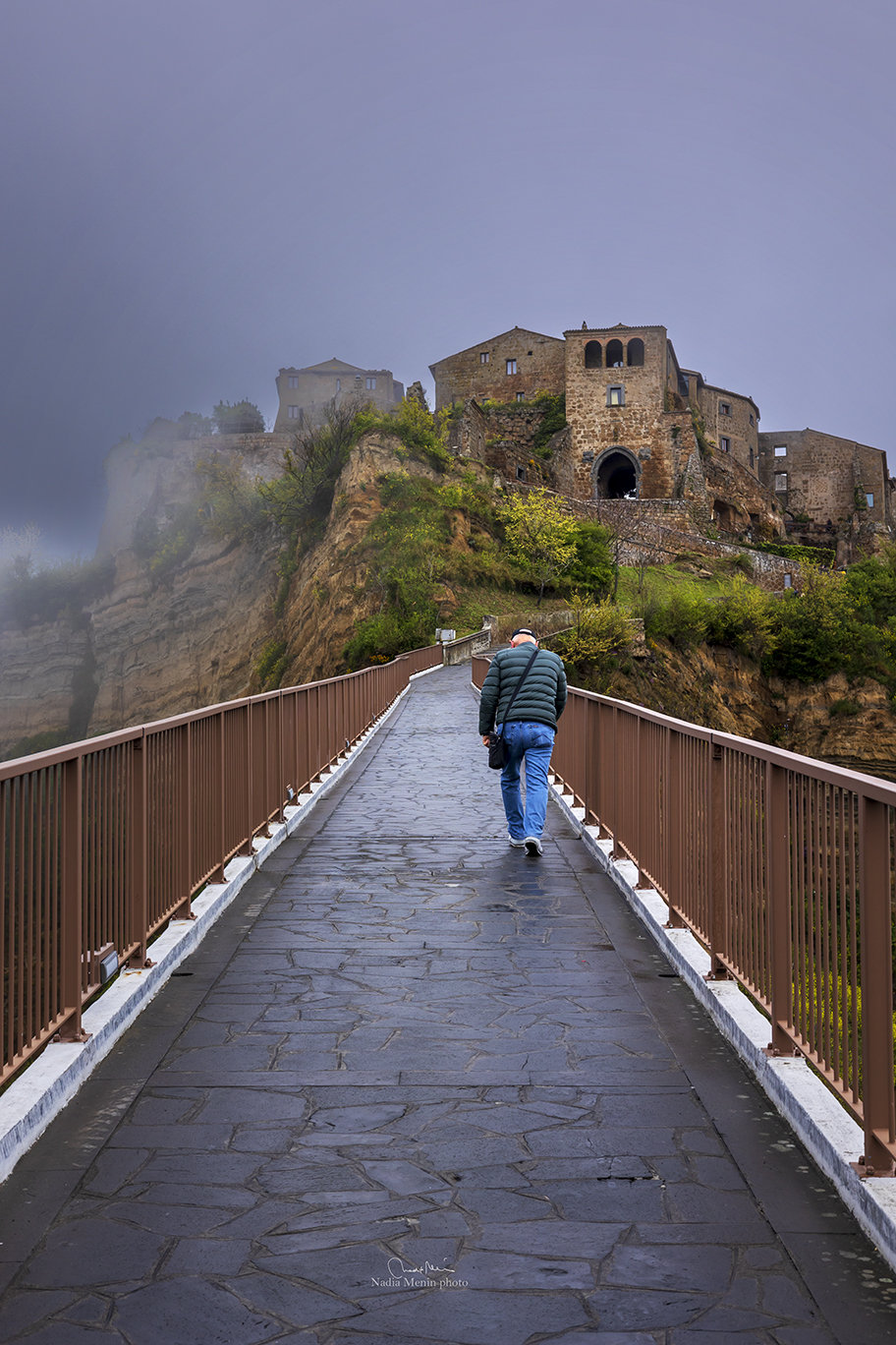 Civita immersed in fog after rain