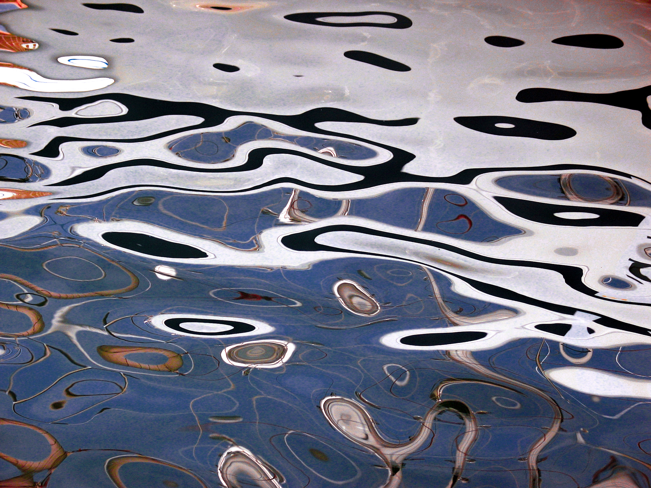 _ oil reflections between boats