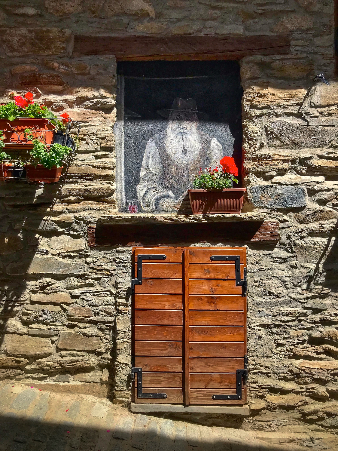 The glass of wine on the windowsill