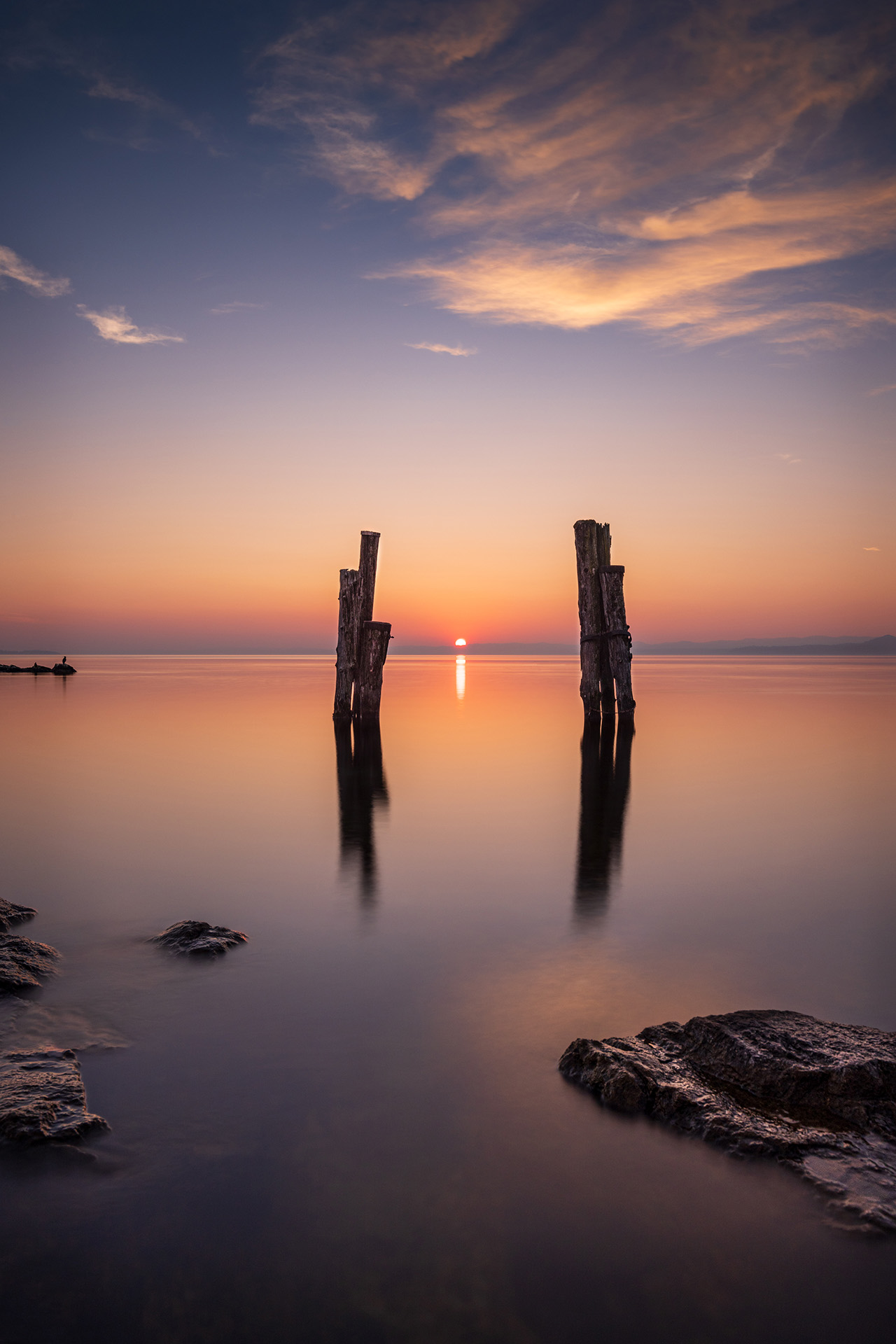 The warm colors of the sunset over the lake