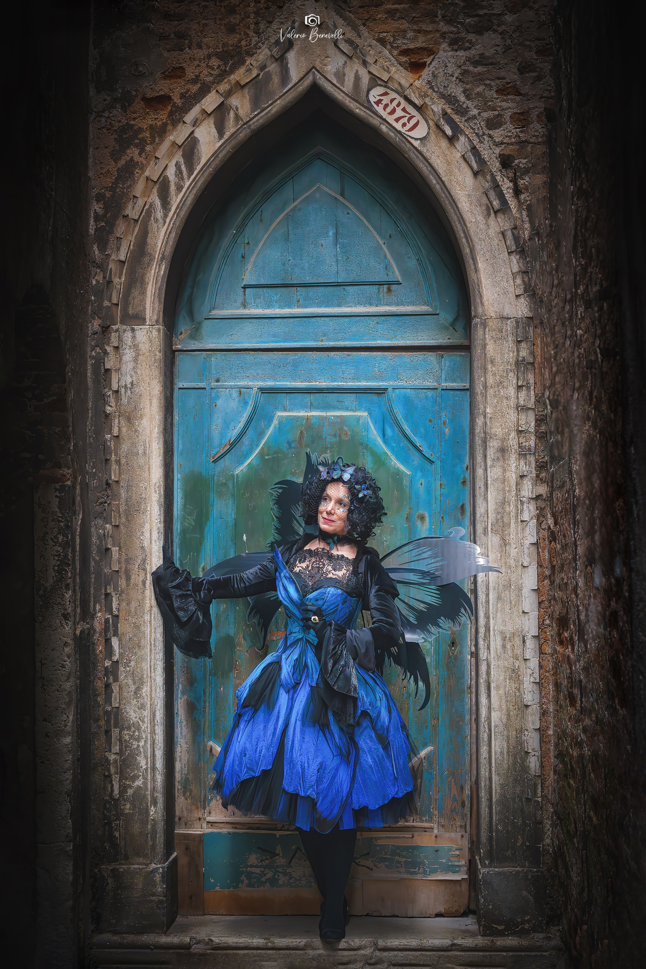 A butterfly at the blue door