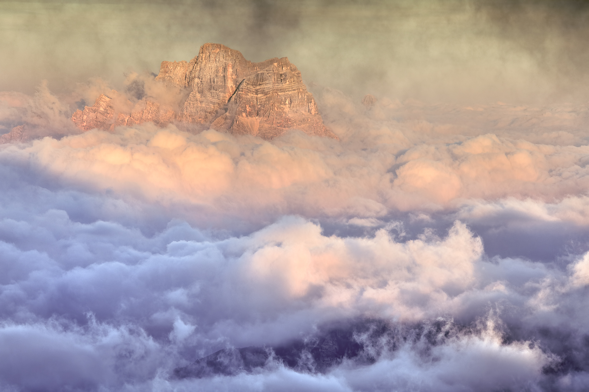 Pelmo in the clouds at sunset