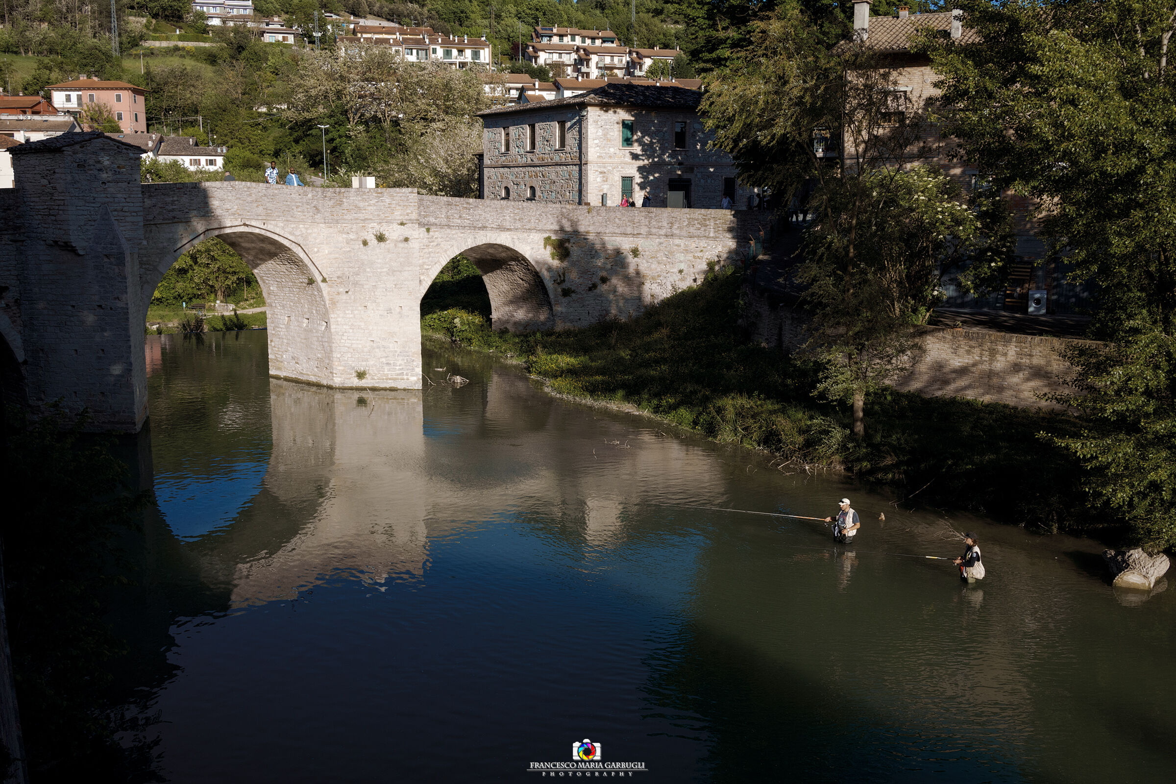 Fishermen under the Roman Bridge