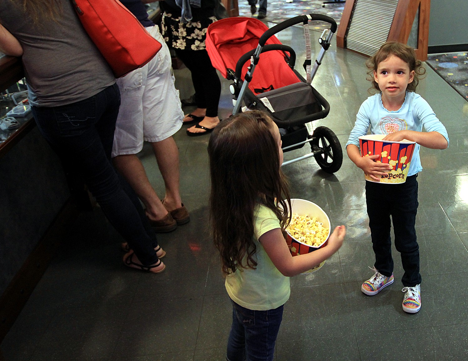 small girls, big popcorn