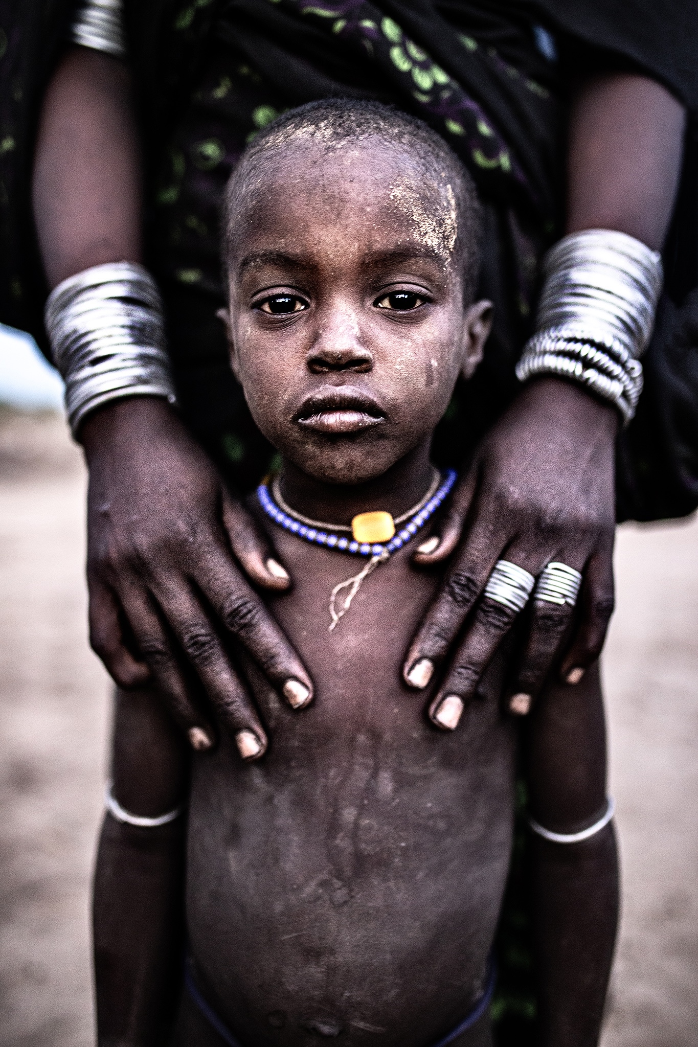 Mum, my eyes in your hands.. Mursi tribe