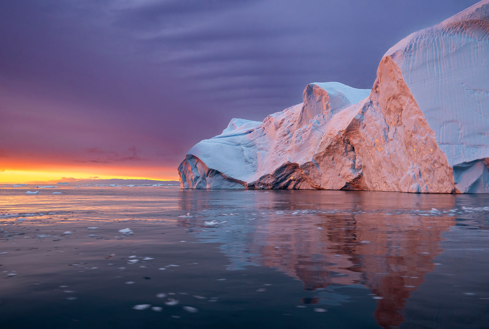 Purple sunset between the icebergs of Disko Bay