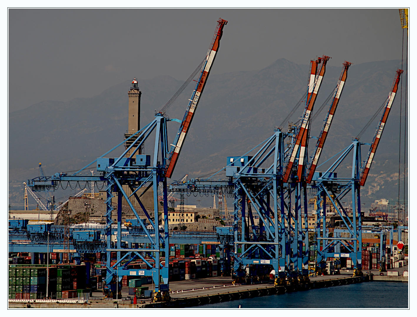 Glimpse of the port of Genoa on a hazy day.