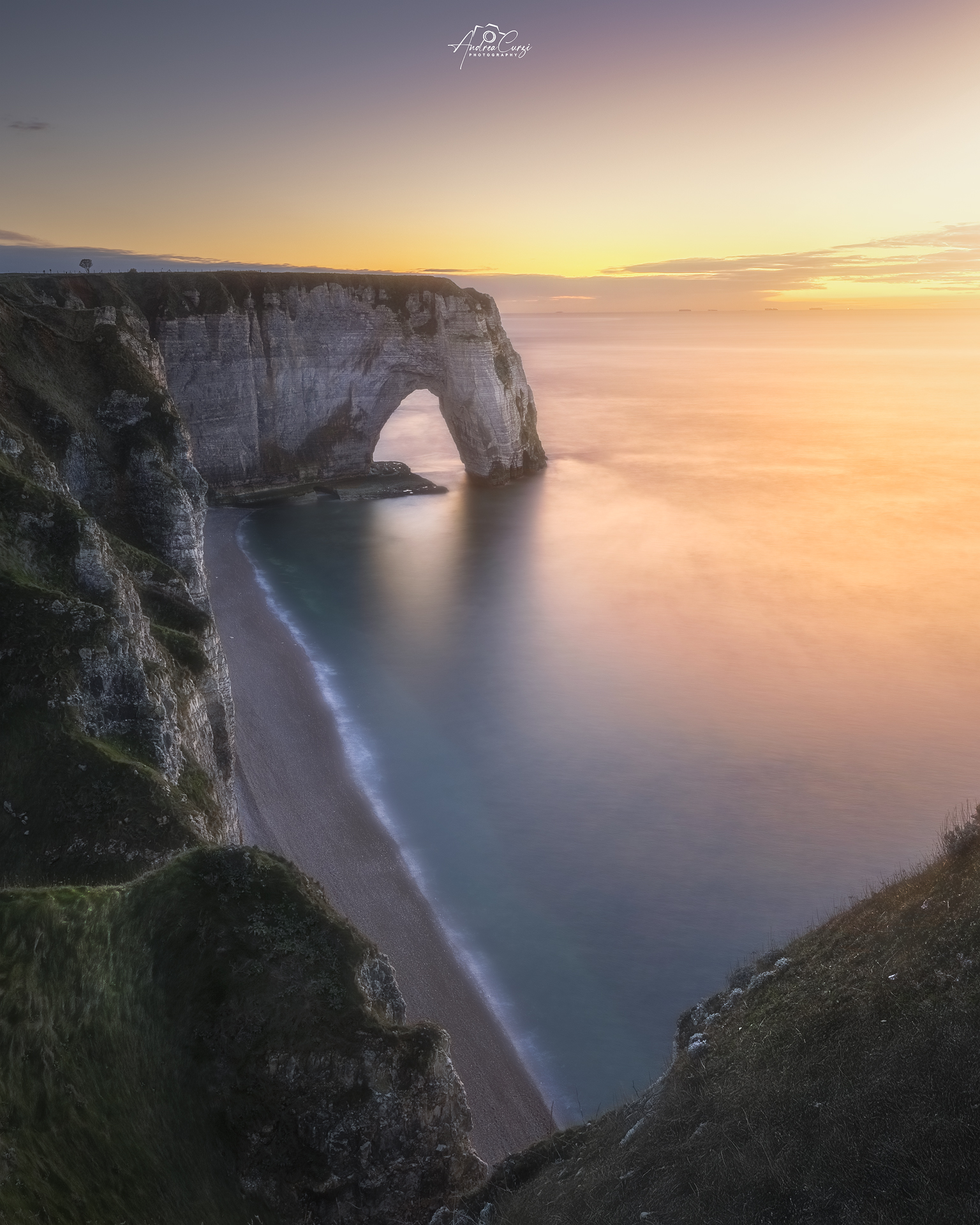 The last lights of the sunset over Etretat