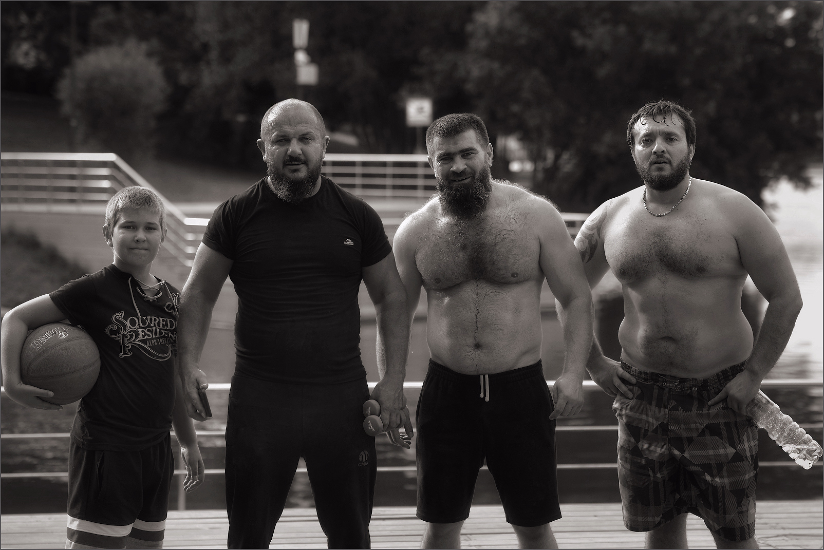 Three athletes and an aspirant in a park in Moscow