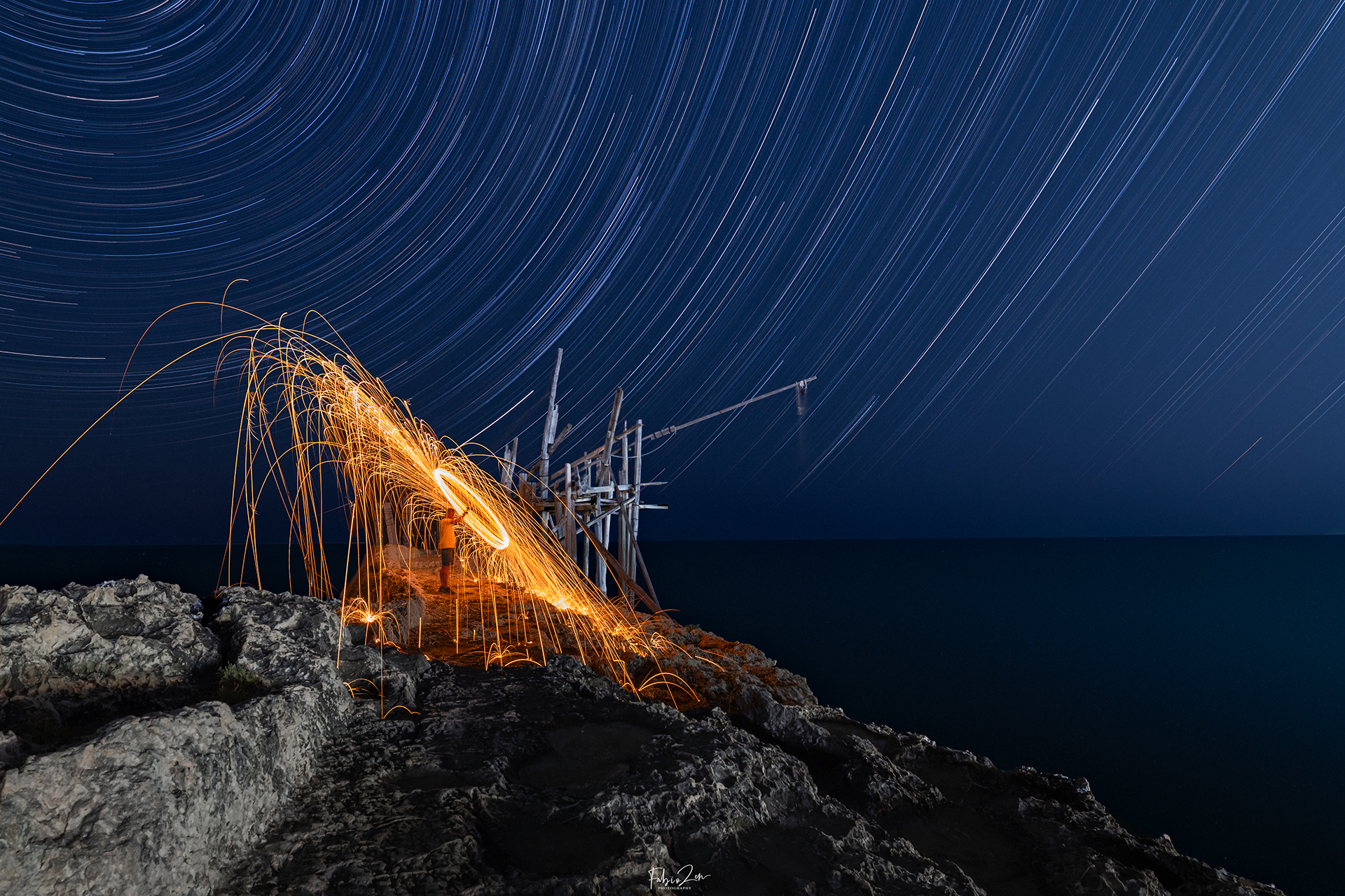 Sparks of fire among the trails of stars