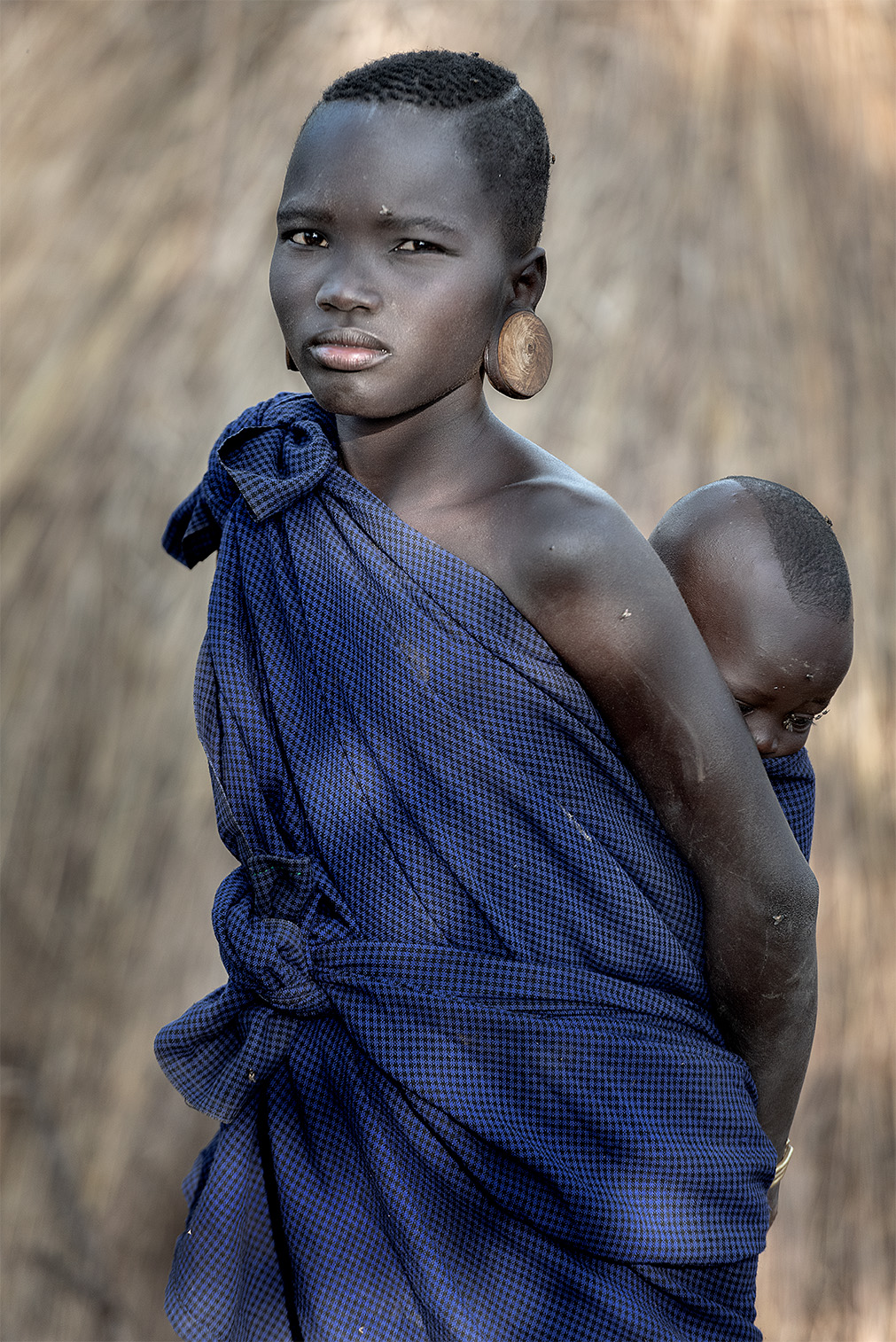 Sister as a Mom- Mursi Tribe