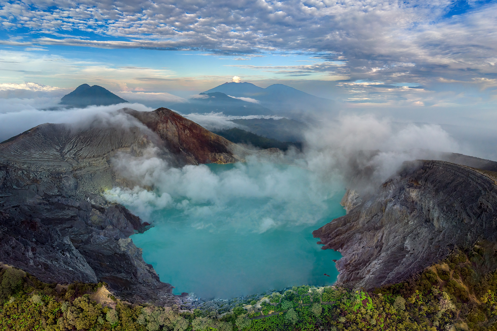 Panorama from above of the acid lake of the Ijen volcano