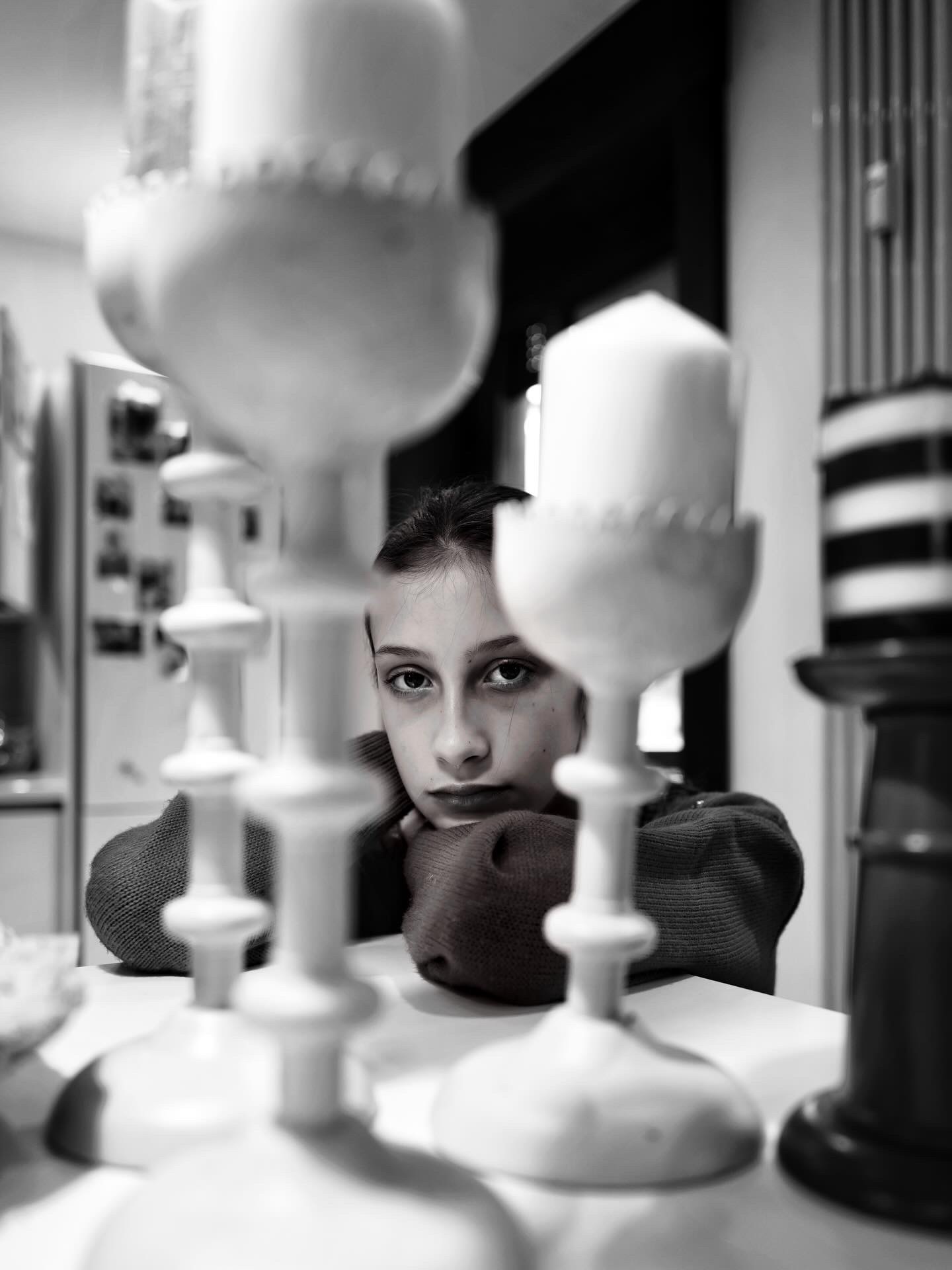 I sneak between the candles