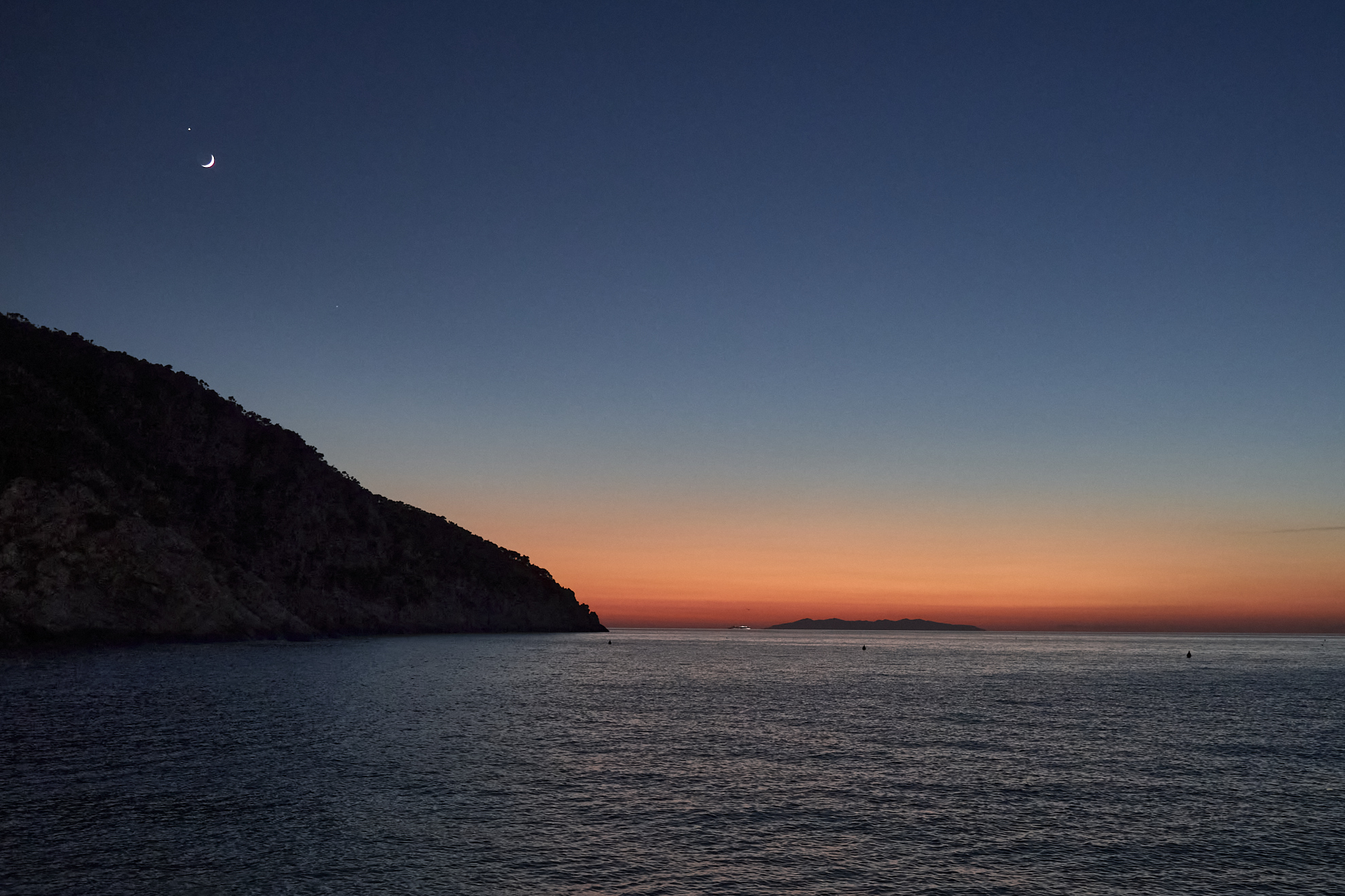 Moon, Venus and the sunset over Capraia