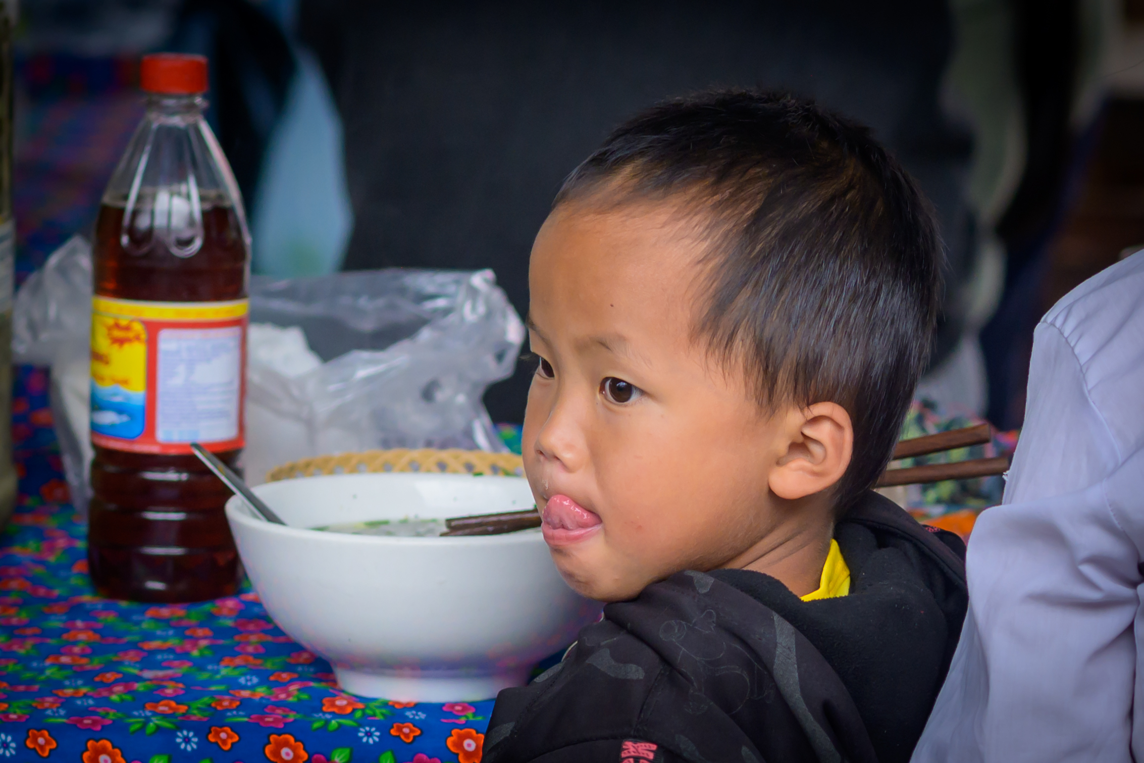 Child enjoying Pho