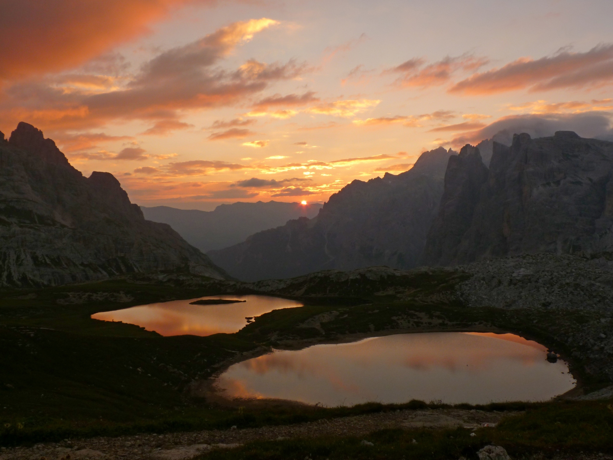 the sun rises from the mountain