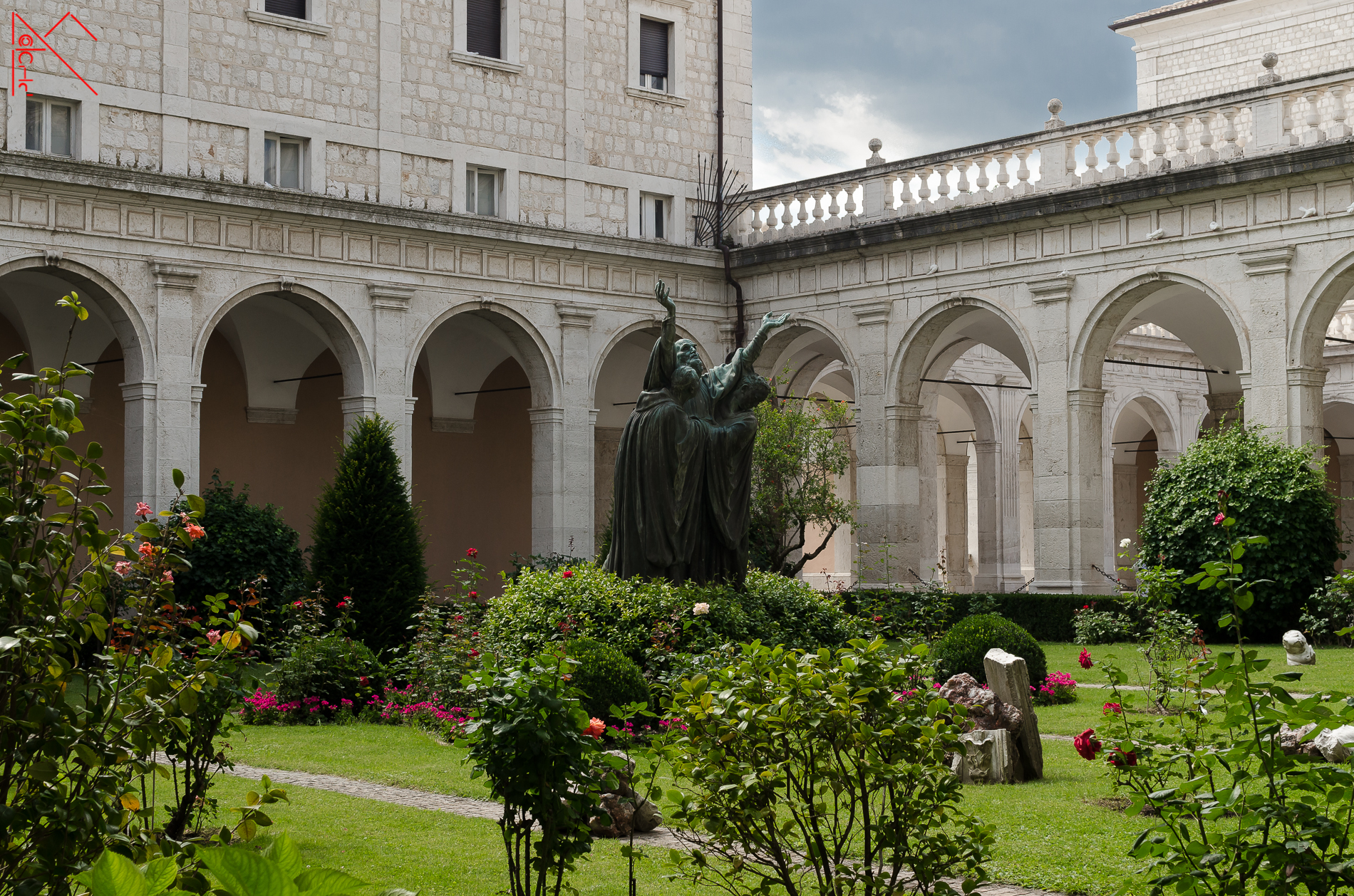 First cloister with a statue of St. Benedict