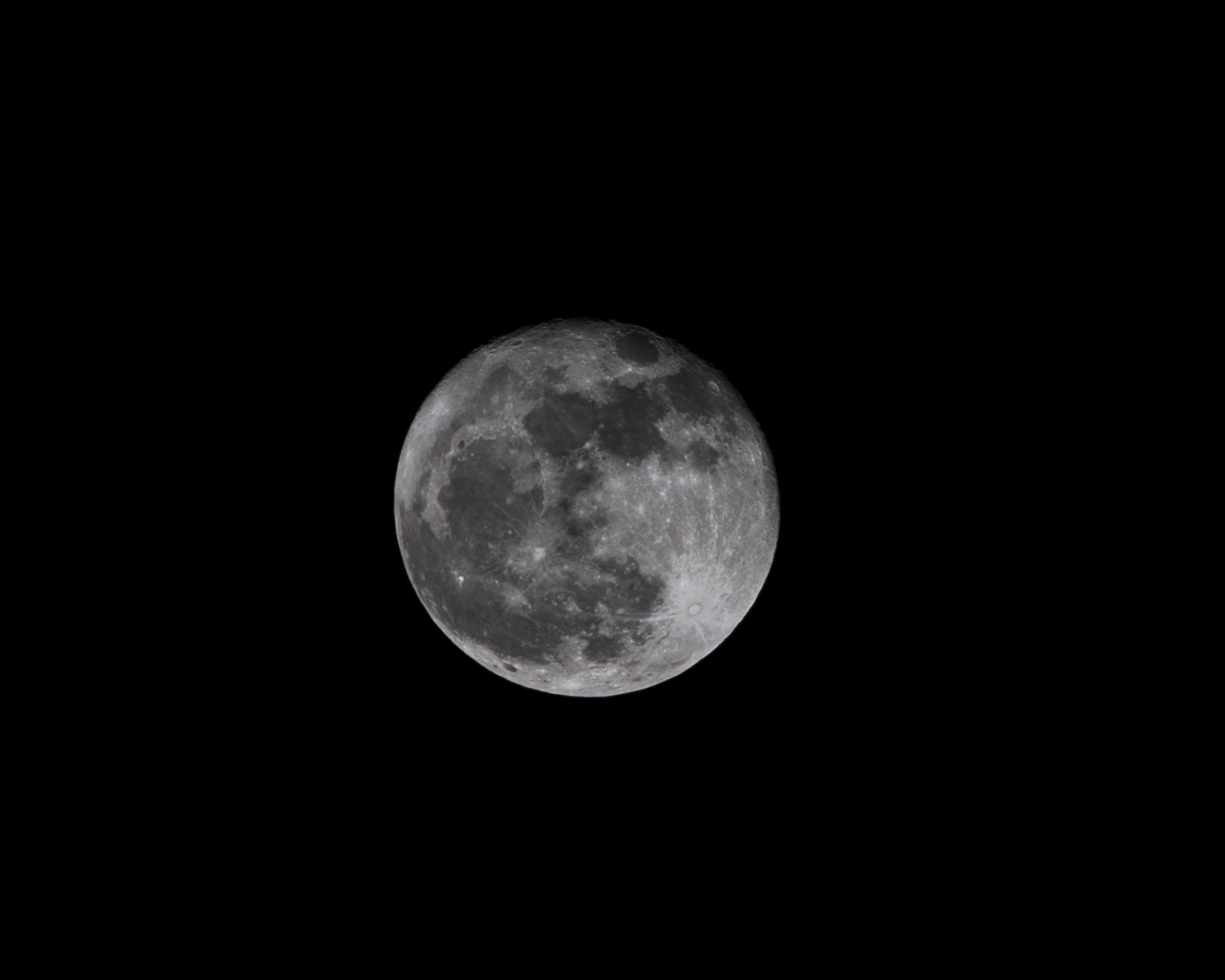 looking at the moon through a porthole