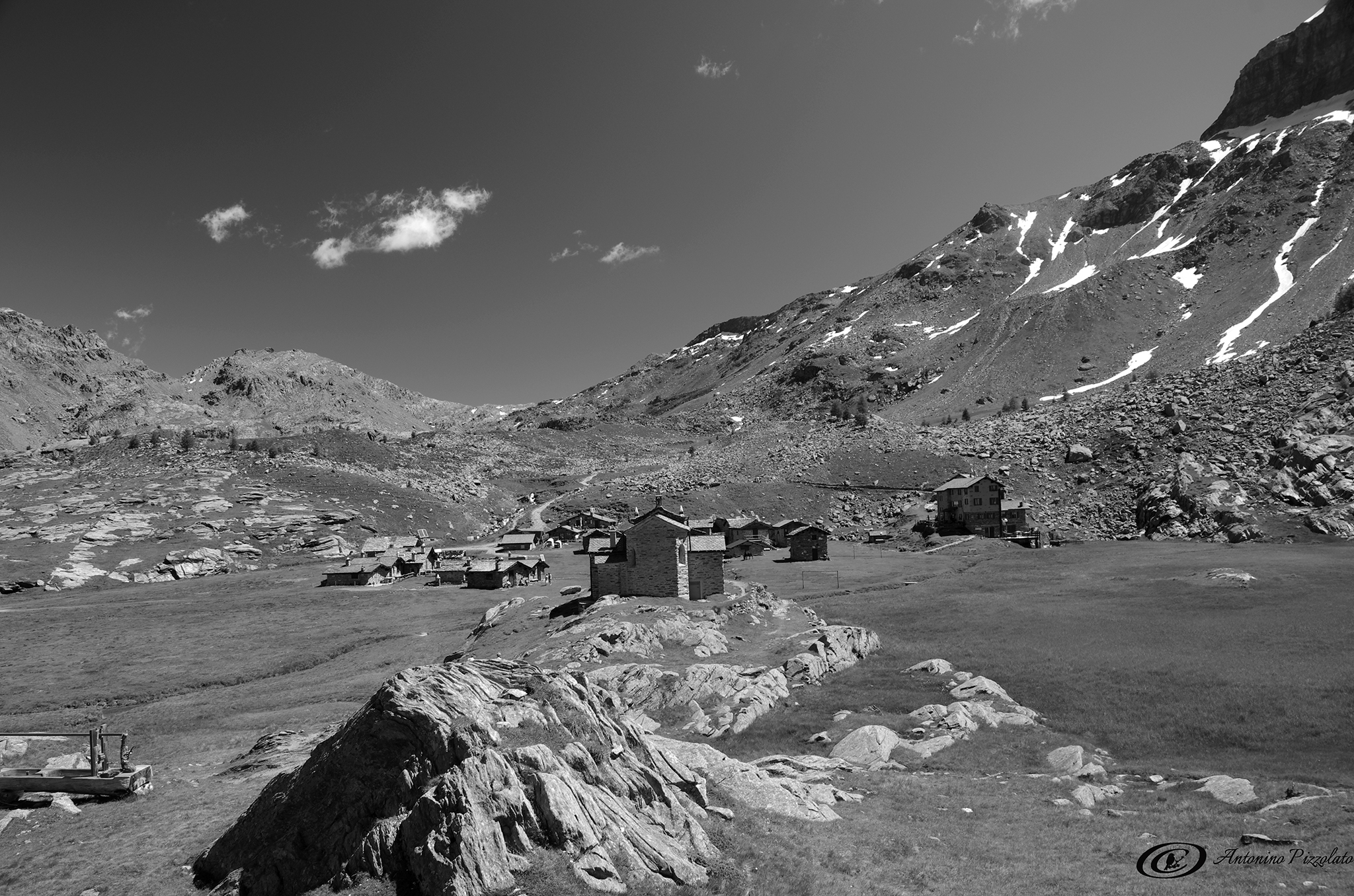 At the foot of the stairs