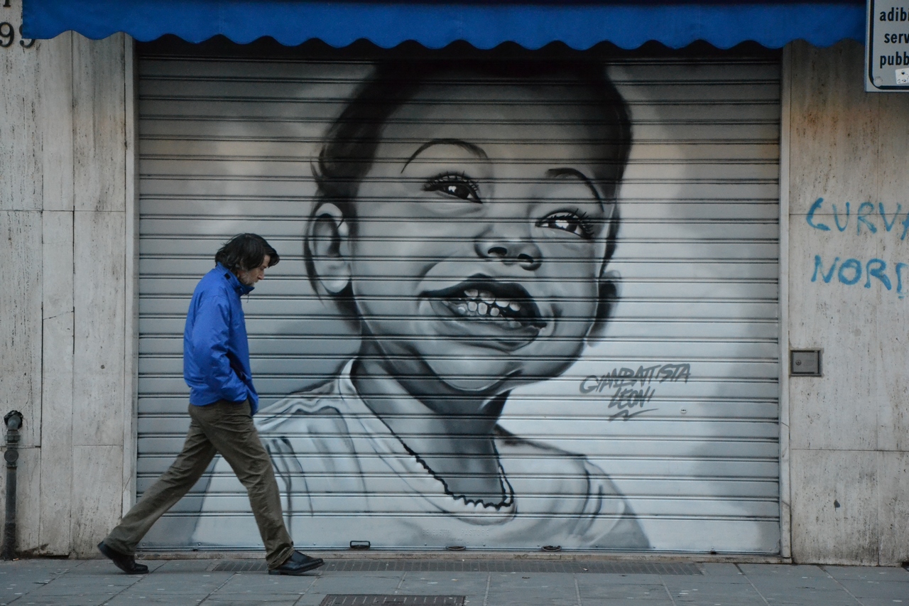 The man in the blue jacket