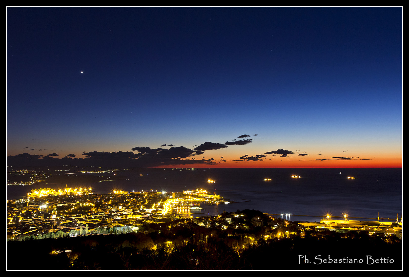 Venus watches over the city, and red fall asleep.