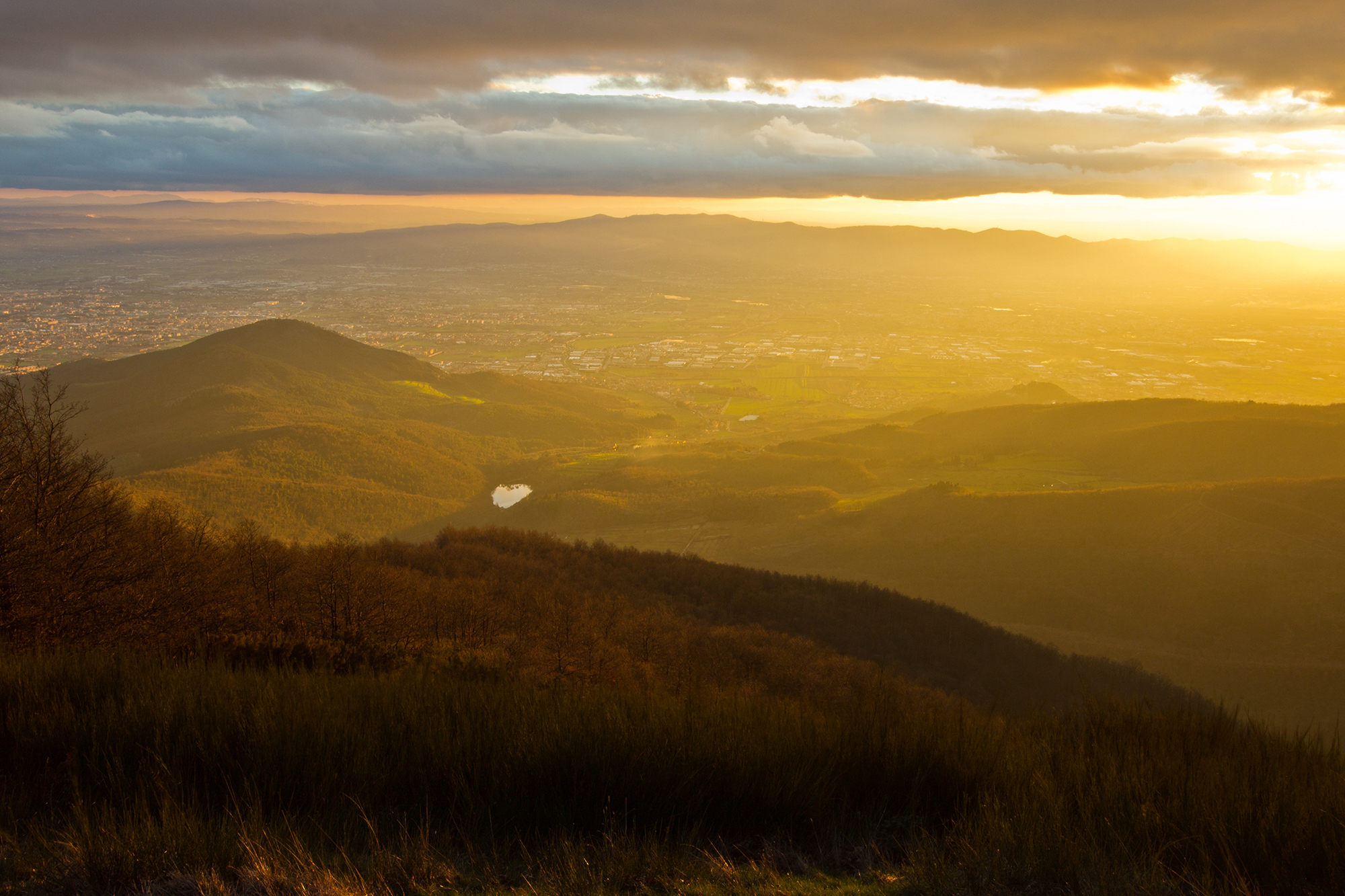 The plain of the city of Prato at sunset