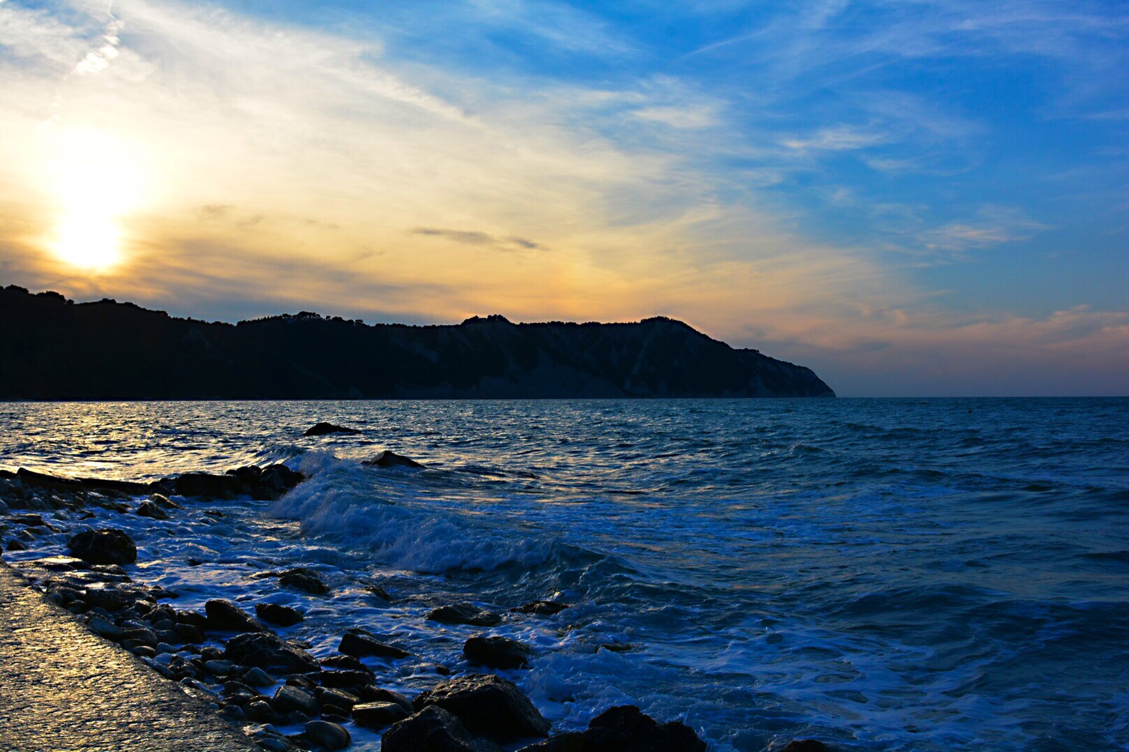 Riviera del Conero - Sunset on the rocks of the beam.