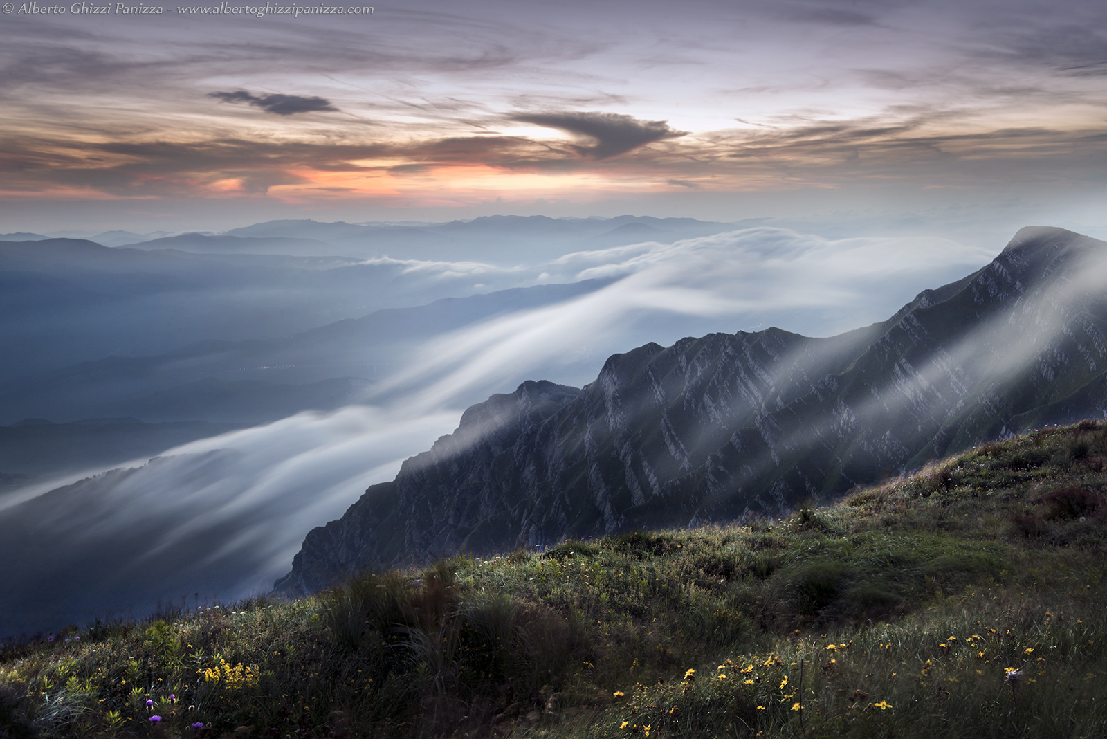 Clouds quick caress the mountains
